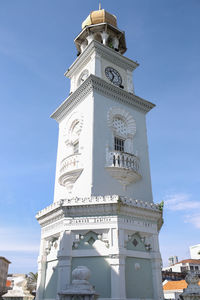 Low angle view of clock tower against sky