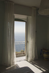 Scenic view of sea seen through balcony