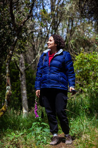 Young woman exploring the nature of a beautiful paramo at the department of cundinamarca in colombia