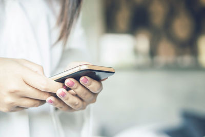 Close-up of woman using mobile phone