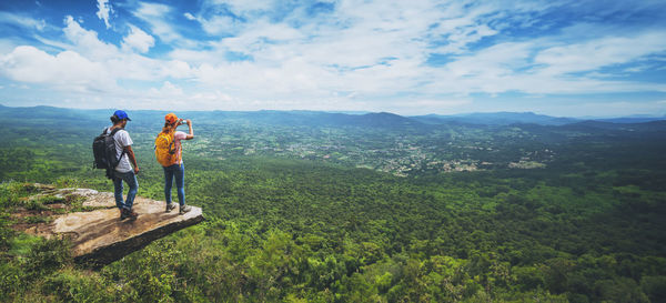 Rear view of man standing on mountain