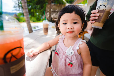Portrait of cute girl having food