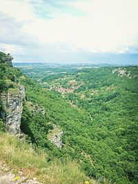Scenic view of landscape against cloudy sky