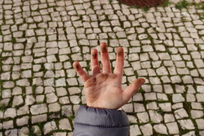 A child's dirty right palm. dirty hands of a child in the sand. hygiene. child cleanliness education