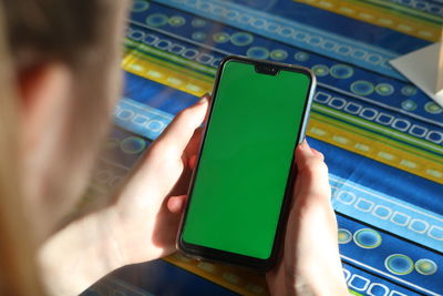 Midsection of man using mobile phone