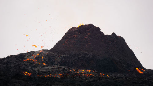 Scenic view of volcanic mountain against clear sky