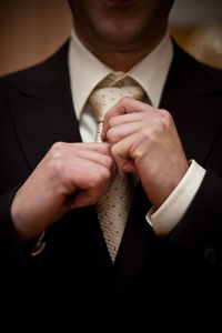 Midsection of businessman wearing suit