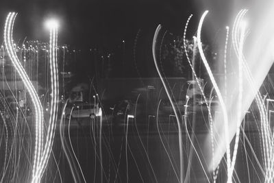 Digital composite image of light trails in city at night