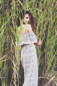 Woman standing in grass