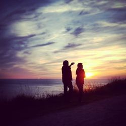 Silhouette of people on beach