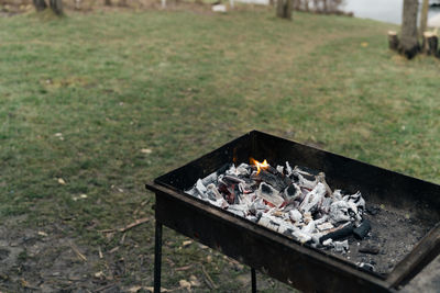 High angle view of bonfire on barbecue grill