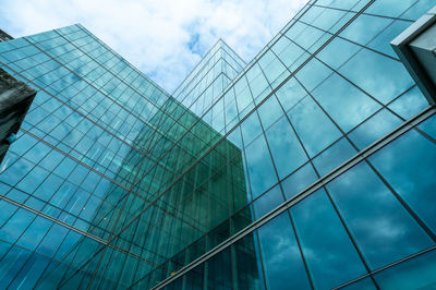 Modern sustainable green glass office building. exterior view of corporate headquarters glass