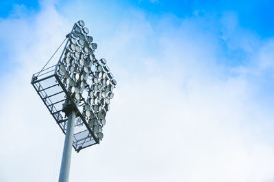 Low angle view of floodlight against sky