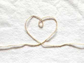 High angle view of heart shape on white background