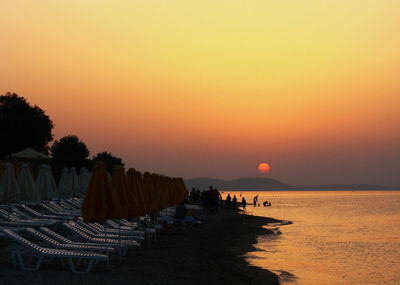 Scenic view of beach against sky during sunset