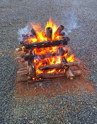 High angle view of bonfire on wood