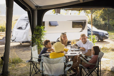 Family sitting at picnic table