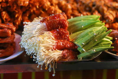 Grilled pork belly with enoki mushrooms and okra