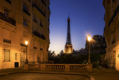 Low angle view of eiffel tower framed by buildings