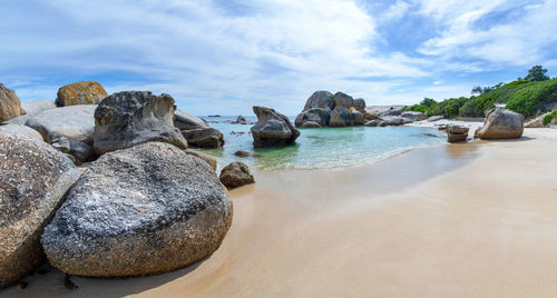 Panoramic view of rocks on beach against sky . boulder beach , cape town , south africa