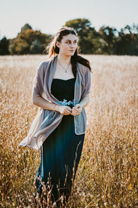 Young woman standing on field