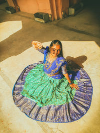 High angle view of woman standing on street