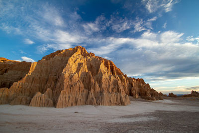 Rock formations in desert against sky