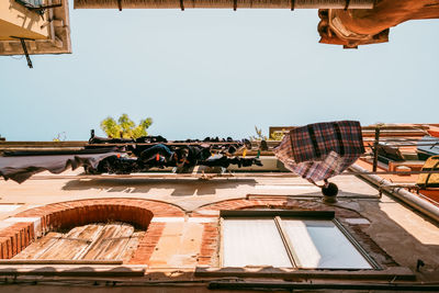 Low angle view of buildings against clear sky