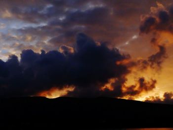 Scenic view of dramatic sky at sunset