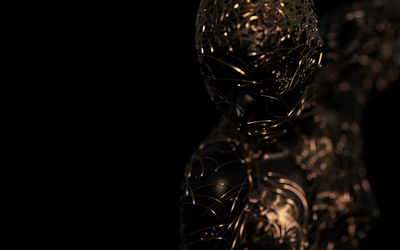 Close-up of glass decoration against black background