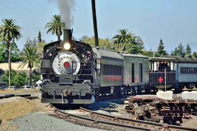 Train on railroad track against sky