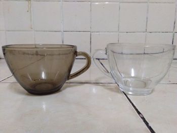 Close-up of empty glasses on table