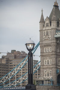 View of bridge and buildings against sky