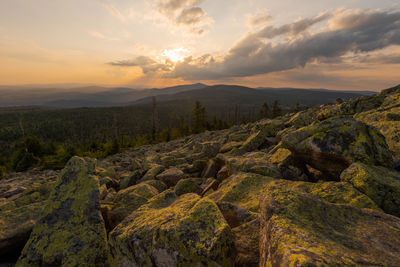 Scenic view of landscape against sky during sunset