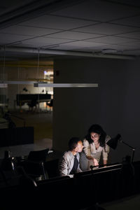 People working late in office