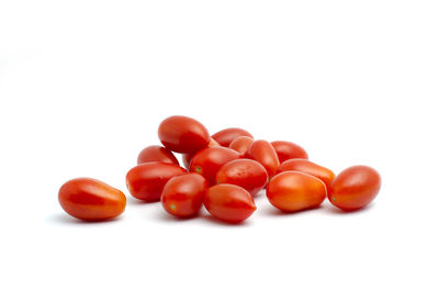 Close-up of tomatoes against white background