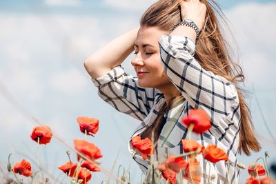Woman by poppies