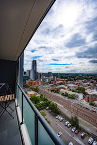 High angle view of city street and buildings against sky