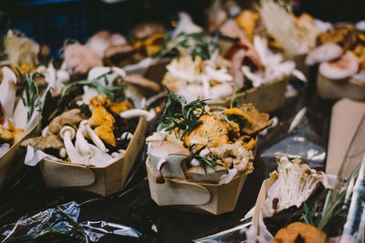 Close-up of food in containers for sale