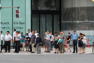 Group of people standing on street