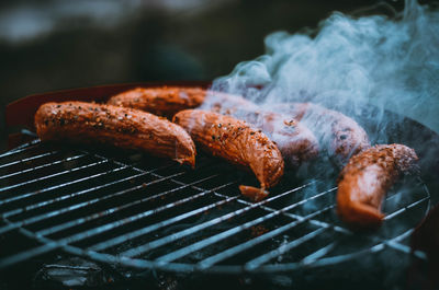 Close-up of sausages on barbecue grill