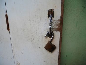 Close-up of padlock on metal door