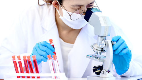 Woman performing experiment on samples