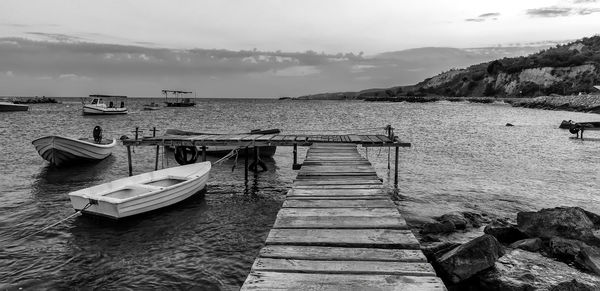 Pier over sea against sky