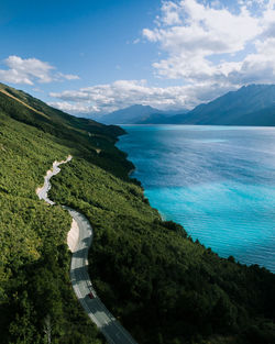 High angle view of road by sea against sky