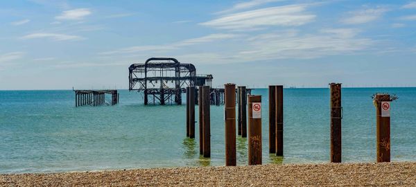Pier over sea against sky