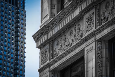 Low angle view of building against sky in city