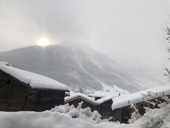 Snow covered mountain against sky