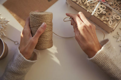 Cropped hand of woman holding gift