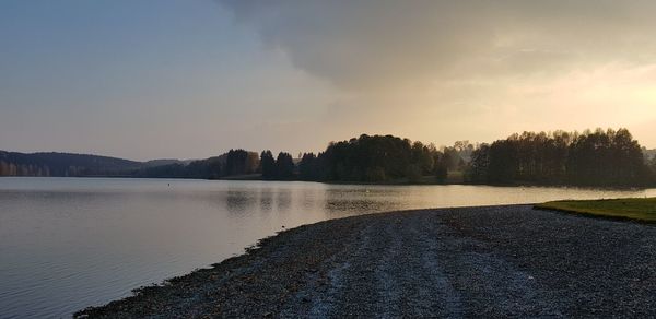 Scenic view of lake against sky during sunset